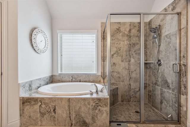 full bath with a bath, a stall shower, and lofted ceiling