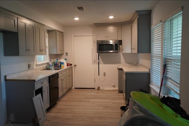 123 25th Ave N, Texas City, TX 77590 - kitchen with dishwasher, stainless steel microwave, healthy amount of natural light, and recessed lighting