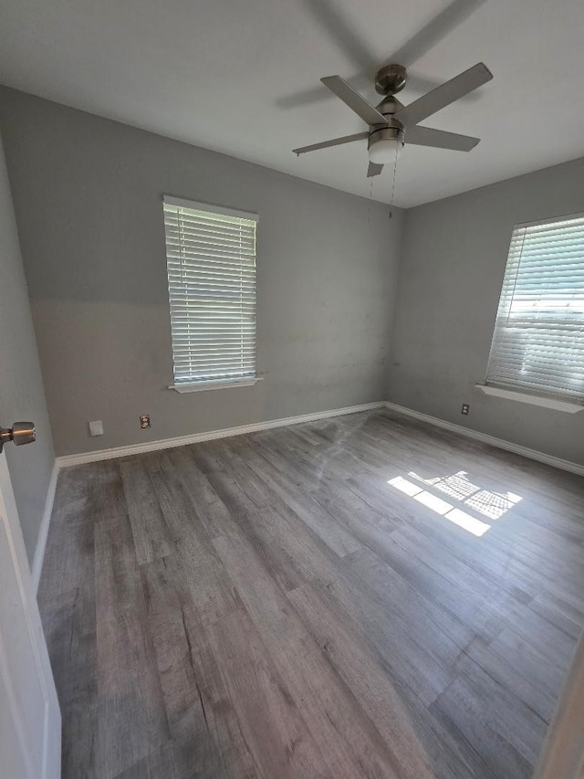 123 25th Ave N, Texas City, TX 77590 - unfurnished room featuring wood finished floors, a ceiling fan, and baseboards