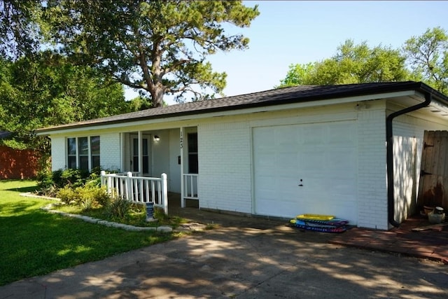123 25th Ave N, Texas City, TX 77590 - ranch-style house featuring brick siding, a porch, and a garage