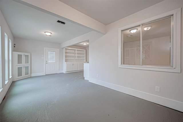 103 Anna St, Tomball, TX 77375 - spare room featuring baseboards and concrete flooring