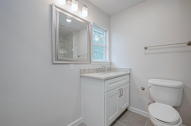 103 Anna St, Tomball, TX 77375 - bathroom featuring baseboards, vanity, toilet, and tile patterned flooring