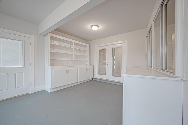 103 Anna St, Tomball, TX 77375 - unfurnished dining area with french doors and finished concrete flooring