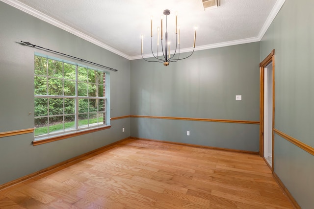 19906 Bayberry Creek Dr, Magnolia, TX 77355 - unfurnished room with wood finished floors, a chandelier, ornamental molding, and baseboards