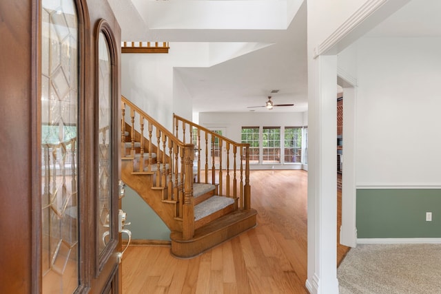 19906 Bayberry Creek Dr, Magnolia, TX 77355 - stairs featuring ceiling fan, wood finished floors, and baseboards