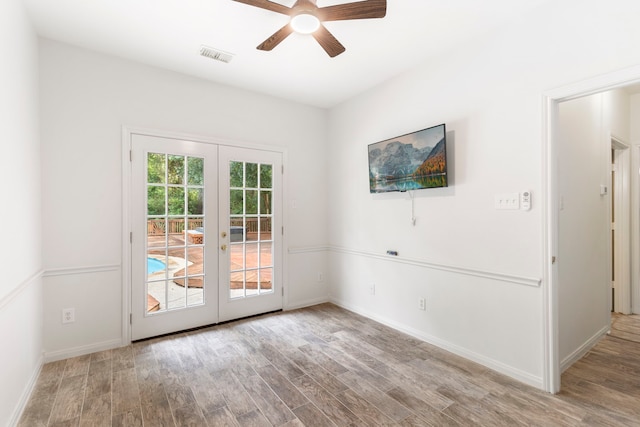 19906 Bayberry Creek Dr, Magnolia, TX 77355 - doorway featuring french doors, a ceiling fan, wood finished floors, and baseboards
