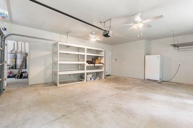 19906 Bayberry Creek Dr, Magnolia, TX 77355 - garage with a ceiling fan, a garage door opener, freestanding refrigerator, and water heater