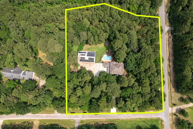 19906 Bayberry Creek Dr, Magnolia, TX 77355 - aerial view of property and surrounding area with a heavily wooded area and property parcel outlined