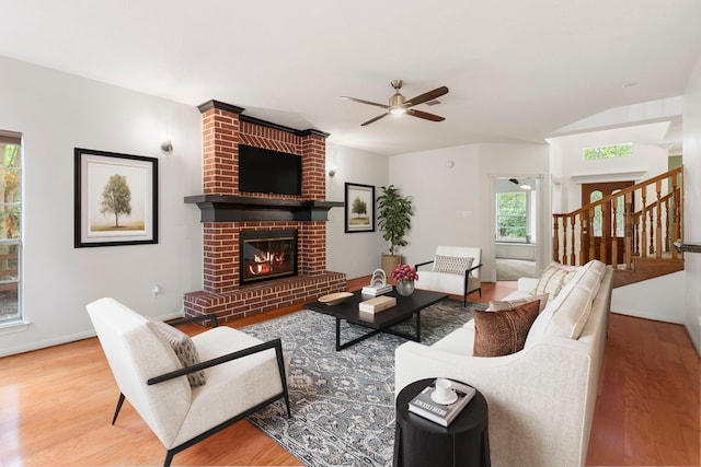 19906 Bayberry Creek Dr, Magnolia, TX 77355 - living room featuring wood finished floors, ceiling fan, a fireplace, and baseboards