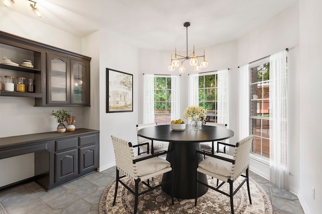 19906 Bayberry Creek Dr, Magnolia, TX 77355 - dining area with plenty of natural light, a chandelier, baseboards, and an office area