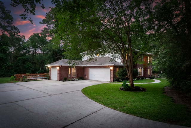 19906 Bayberry Creek Dr, Magnolia, TX 77355 - view of front of house featuring a front lawn, an attached garage, concrete driveway, and brick siding