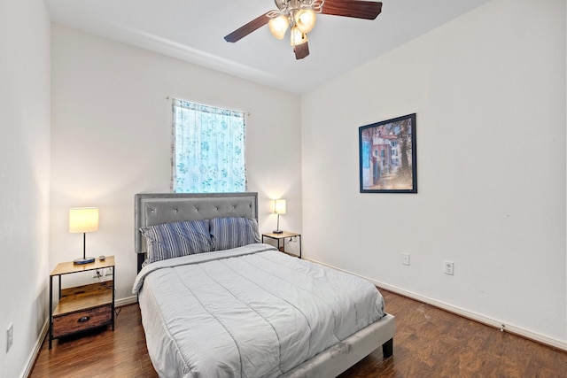 2107 54th St, Galveston, TX 77551 - bedroom with baseboards, wood finished floors, and a ceiling fan