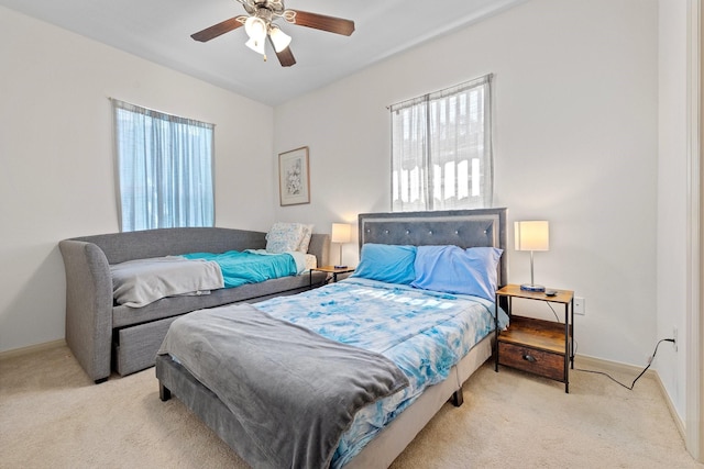 2107 54th St, Galveston, TX 77551 - carpeted bedroom featuring baseboards and a ceiling fan