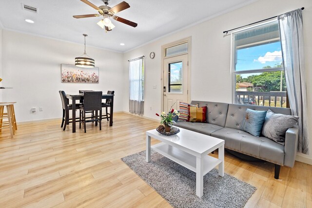 2107 54th St, Galveston, TX 77551 - living room with ornamental molding, ceiling fan, light wood-style floors, recessed lighting, and baseboards