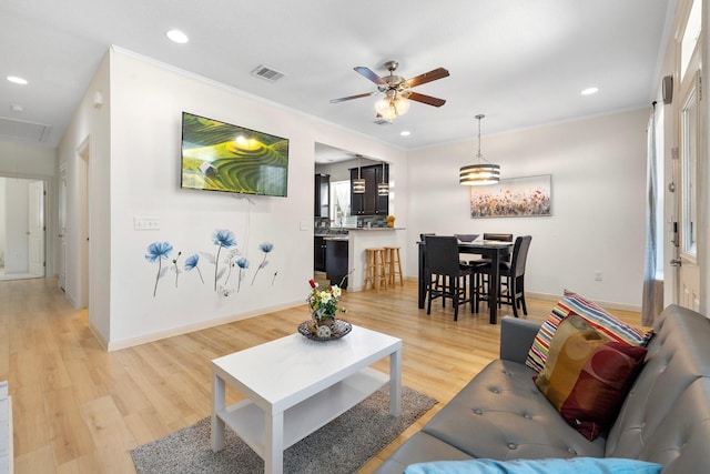 2107 54th St, Galveston, TX 77551 - living area featuring attic access, a ceiling fan, light wood-style floors, recessed lighting, and ornamental molding