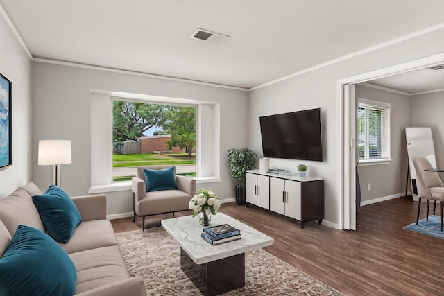 211 Cedar Ln, El Lago, TX 77586 - living area featuring dark wood-type flooring, baseboards, and ornamental molding