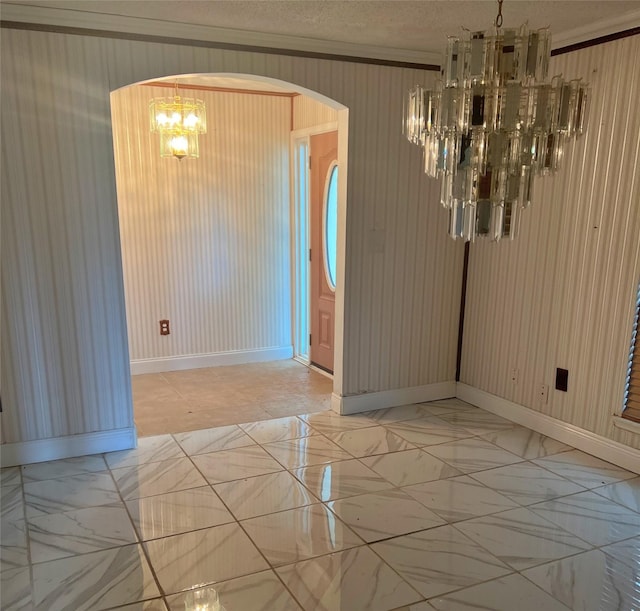 3811 Empress Ln, Richmond, TX 77406 - unfurnished dining area featuring a chandelier, arched walkways, baseboards, light marble finish floors, and crown molding