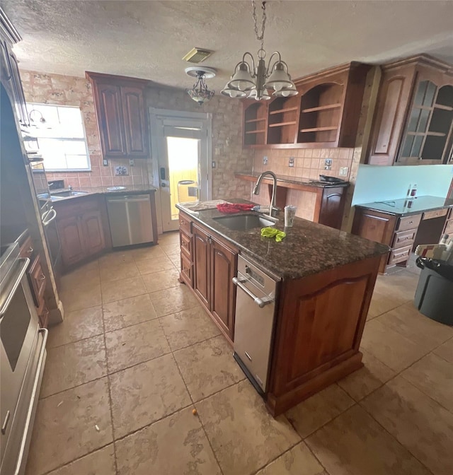 3811 Empress Ln, Richmond, TX 77406 - kitchen featuring dishwasher, a sink, healthy amount of natural light, tasteful backsplash, and a textured ceiling