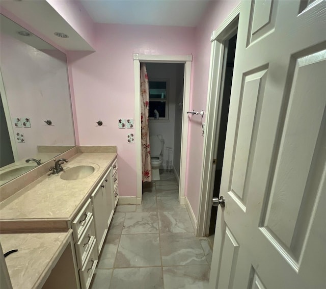 3811 Empress Ln, Richmond, TX 77406 - bathroom with marble finish flooring, toilet, baseboards, and vanity