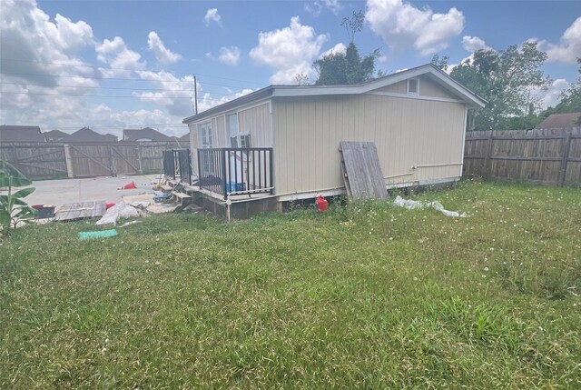 3811 Empress Ln, Richmond, TX 77406 - view of home's exterior featuring a deck