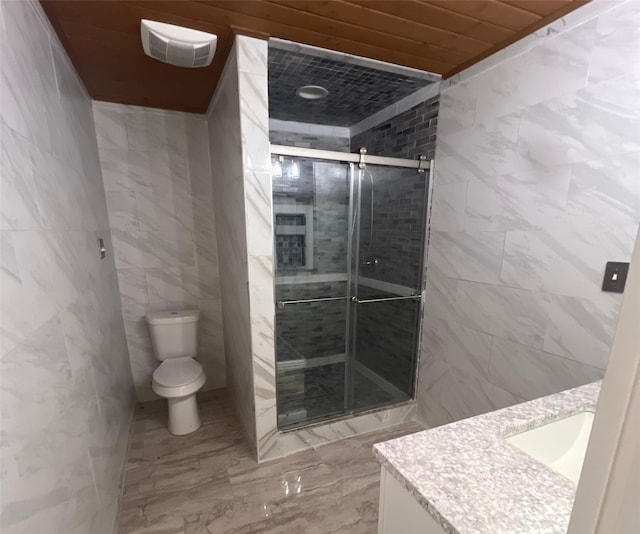 3811 Empress Ln, Richmond, TX 77406 - full bath featuring tile walls, a stall shower, toilet, vanity, and marble finish floors