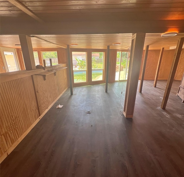 3811 Empress Ln, Richmond, TX 77406 - unfurnished living room with dark wood-style floors and wood walls