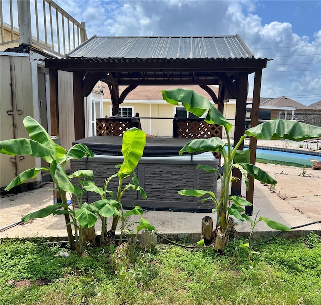 3811 Empress Ln, Richmond, TX 77406 - view of patio featuring a gazebo, a covered hot tub, a swimming pool, and fence