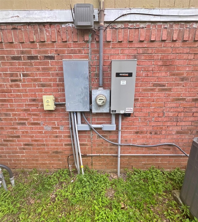3811 Empress Ln, Richmond, TX 77406 - exterior view of electric meter, a wood stove, and brick siding