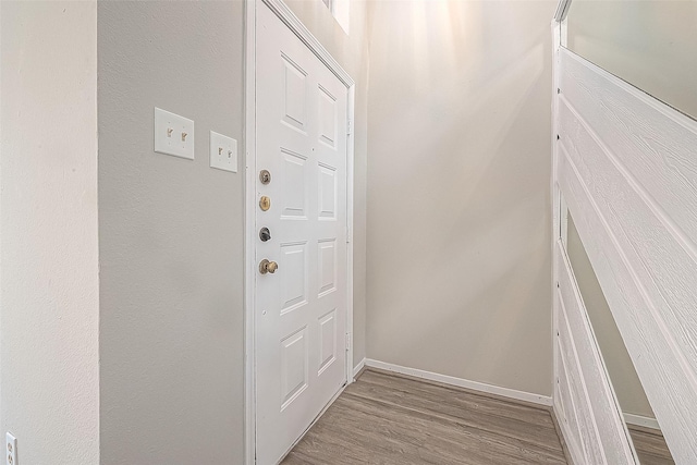 9393 Westwood Village Dr Unit 64, Houston, TX 77036 - doorway featuring wood finished floors and baseboards
