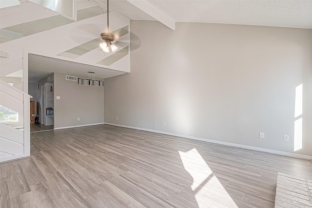 9393 Westwood Village Dr Unit 64, Houston, TX 77036 - unfurnished living room featuring wood finished floors, baseboards, and ceiling fan