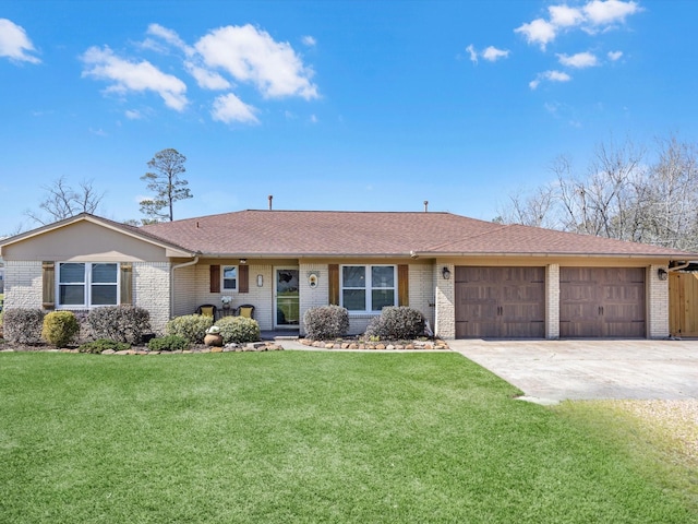316 N Magnolia St, Highlands, TX 77562 - single story home with brick siding, a garage, concrete driveway, a front yard, and roof with shingles
