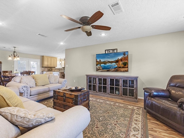 316 N Magnolia St, Highlands, TX 77562 - living room with light wood finished floors, a chandelier, ceiling fan, recessed lighting, and baseboards