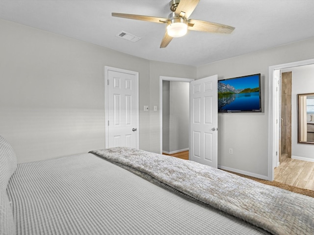316 N Magnolia St, Highlands, TX 77562 - bedroom featuring wood finished floors, baseboards, and ceiling fan