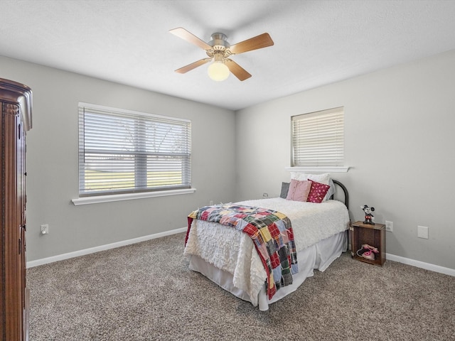 316 N Magnolia St, Highlands, TX 77562 - carpeted bedroom with baseboards and a ceiling fan