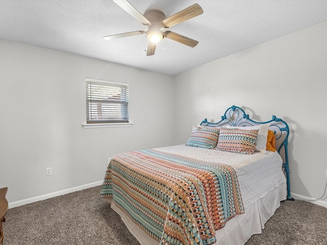 316 N Magnolia St, Highlands, TX 77562 - bedroom with carpet flooring, baseboards, and ceiling fan