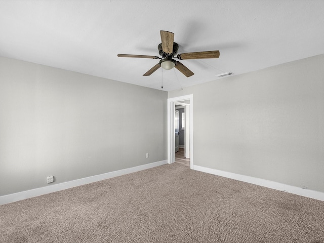 316 N Magnolia St, Highlands, TX 77562 - unfurnished room featuring light colored carpet, ceiling fan, and baseboards