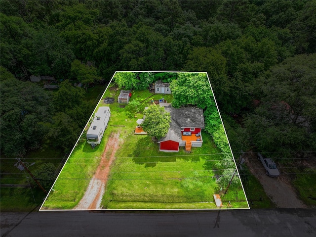 1607 E Pne Lake Cir E, Conroe, TX 77316 - view of property location with property parcel outlined and a heavily wooded area