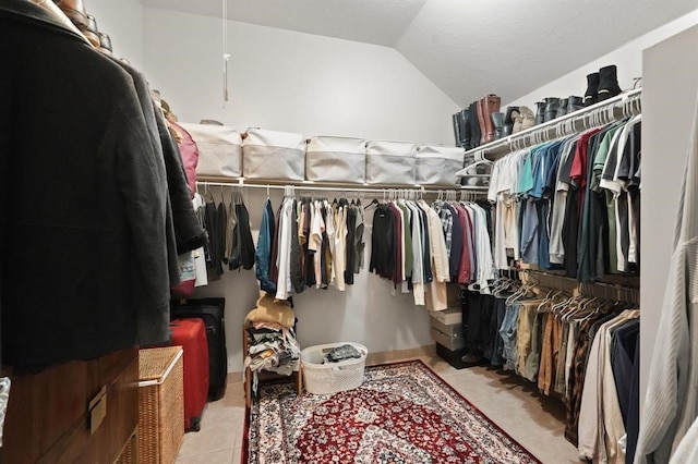 3522 Plymouth Pointe Ln, Missouri City, TX 77459 - spacious closet featuring vaulted ceiling and light tile patterned flooring