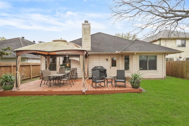 3522 Plymouth Pointe Ln, Missouri City, TX 77459 - back of house with a gazebo, a chimney, a wooden deck, and roof with shingles