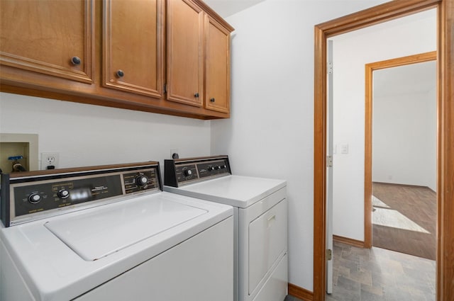 908 W Ln, Crystal Beach, TX 77650 - clothes washing area featuring washing machine and dryer, cabinet space, and baseboards