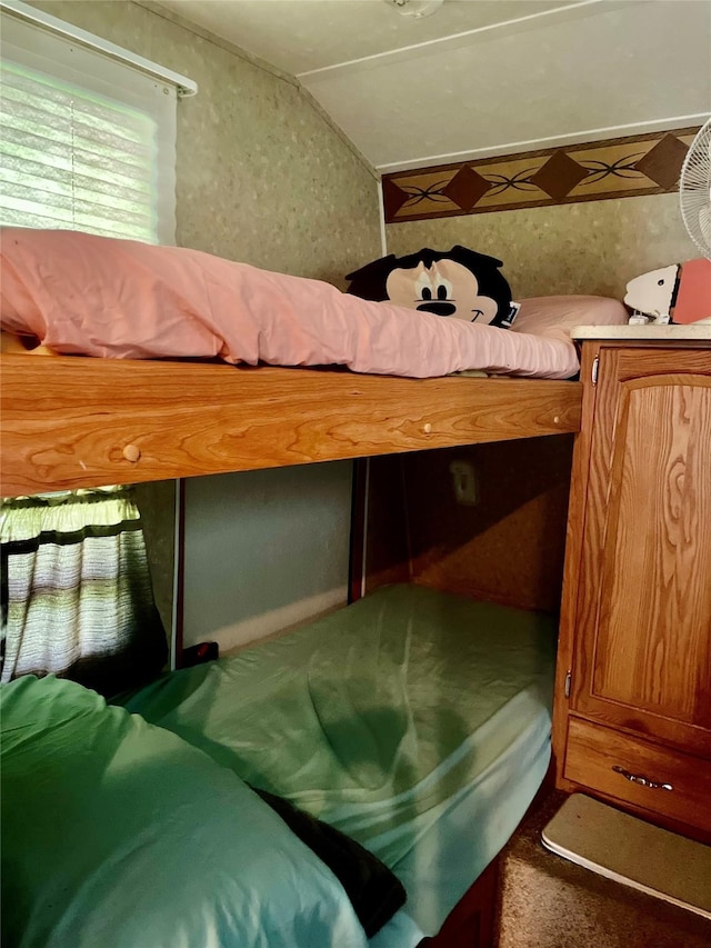 1139 Diamond Rd, Crystal Beach, TX 77650 - carpeted bedroom featuring vaulted ceiling