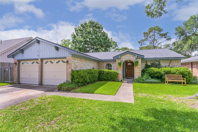 711 Seacliff Dr, Houston, TX 77062 - view of front of property with driveway, a garage, a front lawn, and a shingled roof