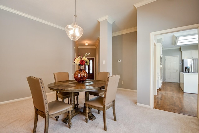 13702 Senca Park Dr, Houston, TX 77077 - dining area featuring crown molding, baseboards, and light colored carpet