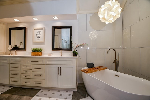 13702 Senca Park Dr, Houston, TX 77077 - bathroom with a freestanding tub, double vanity, recessed lighting, and a chandelier