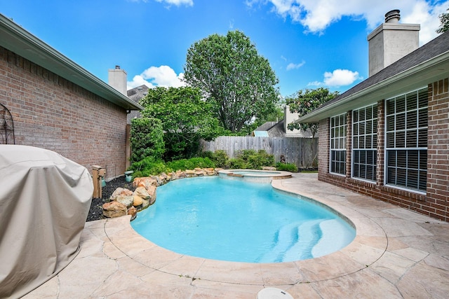 13702 Senca Park Dr, Houston, TX 77077 - view of pool featuring a fenced backyard, a patio area, and a pool with connected hot tub