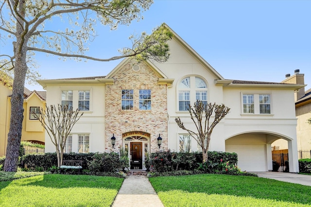 102 Ferndale St, Bellaire, TX 77401 - view of front facade with a garage, driveway, stucco siding, brick siding, and a chimney
