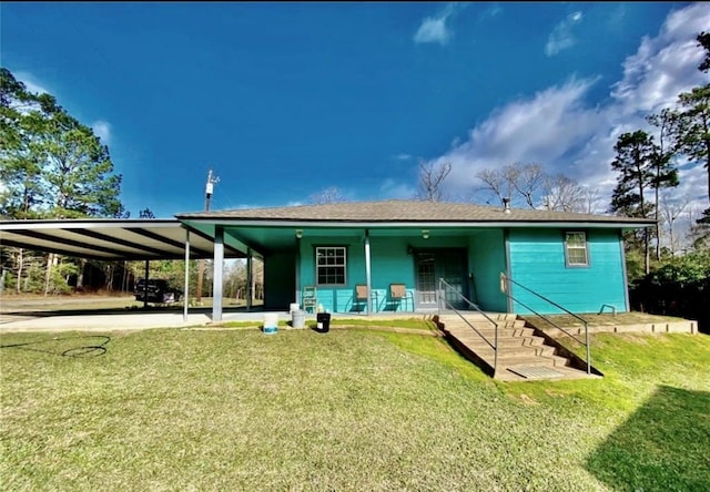 865 Sir Jim Dr, Woodville, TX 75979 - view of front facade with a front lawn, a carport, a porch, and roof with shingles