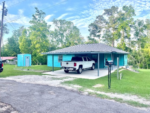 865 Sir Jim Dr, Woodville, TX 75979 - view of car parking featuring driveway, a shed, and an attached carport