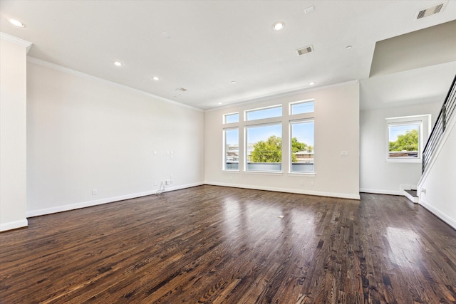 1505 Missouri St, Houston, TX 77006 - unfurnished room featuring ornamental molding, dark wood-style floors, baseboards, recessed lighting, and stairs