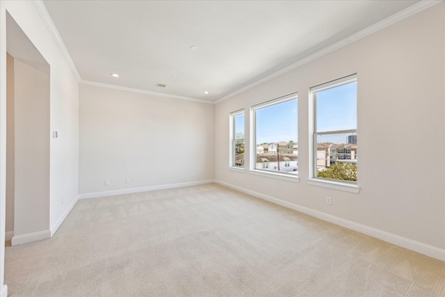 1505 Missouri St, Houston, TX 77006 - spare room with crown molding, light colored carpet, baseboards, and recessed lighting
